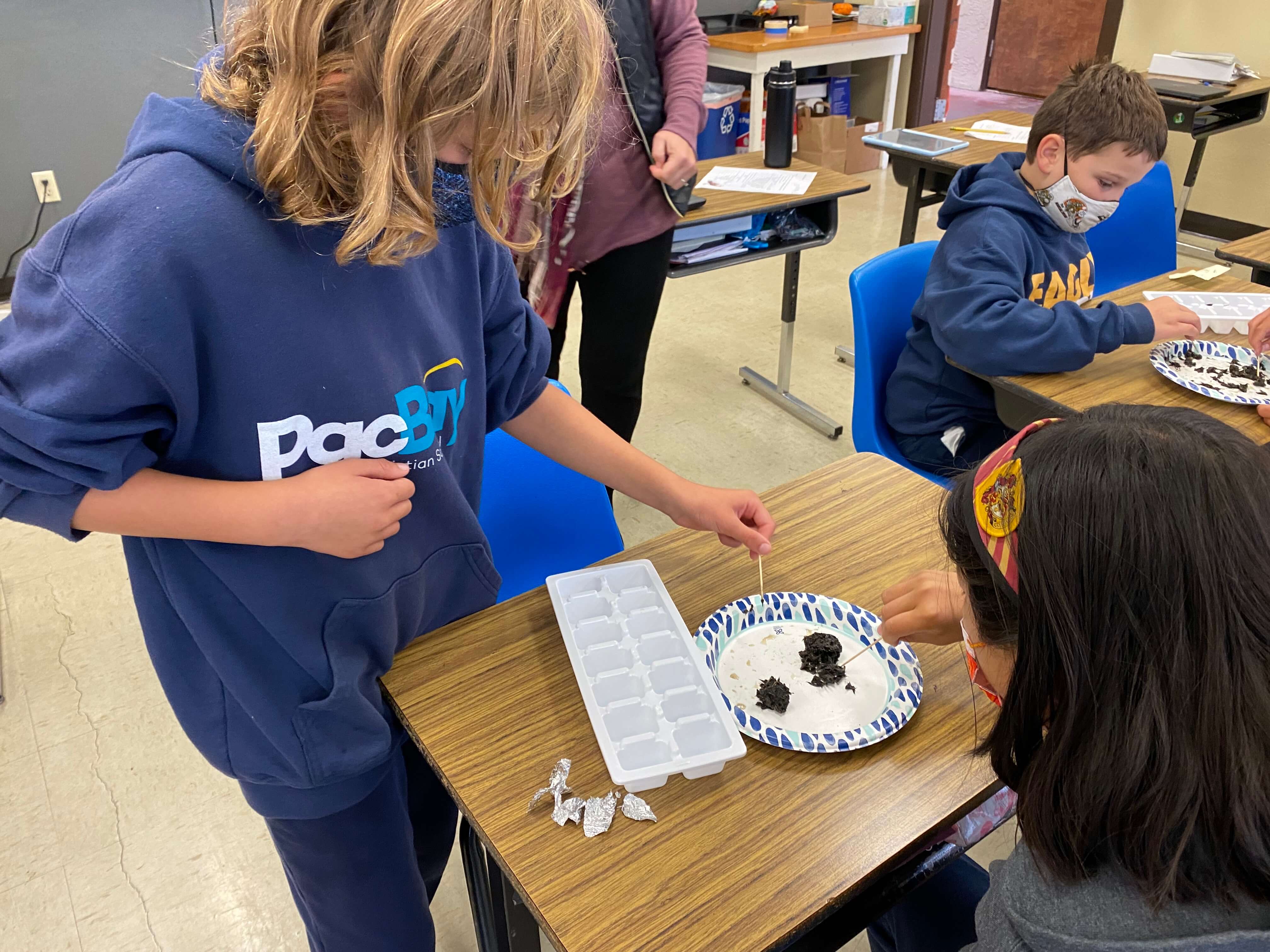 two students doing arts and crafts